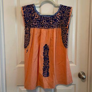 Mi Golondrina Flores short dress in light orange with navy blue embroidery